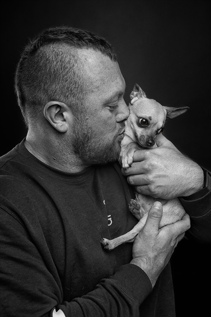 image of Britains strongest man, Adam Bishop with his Chihuahua dog