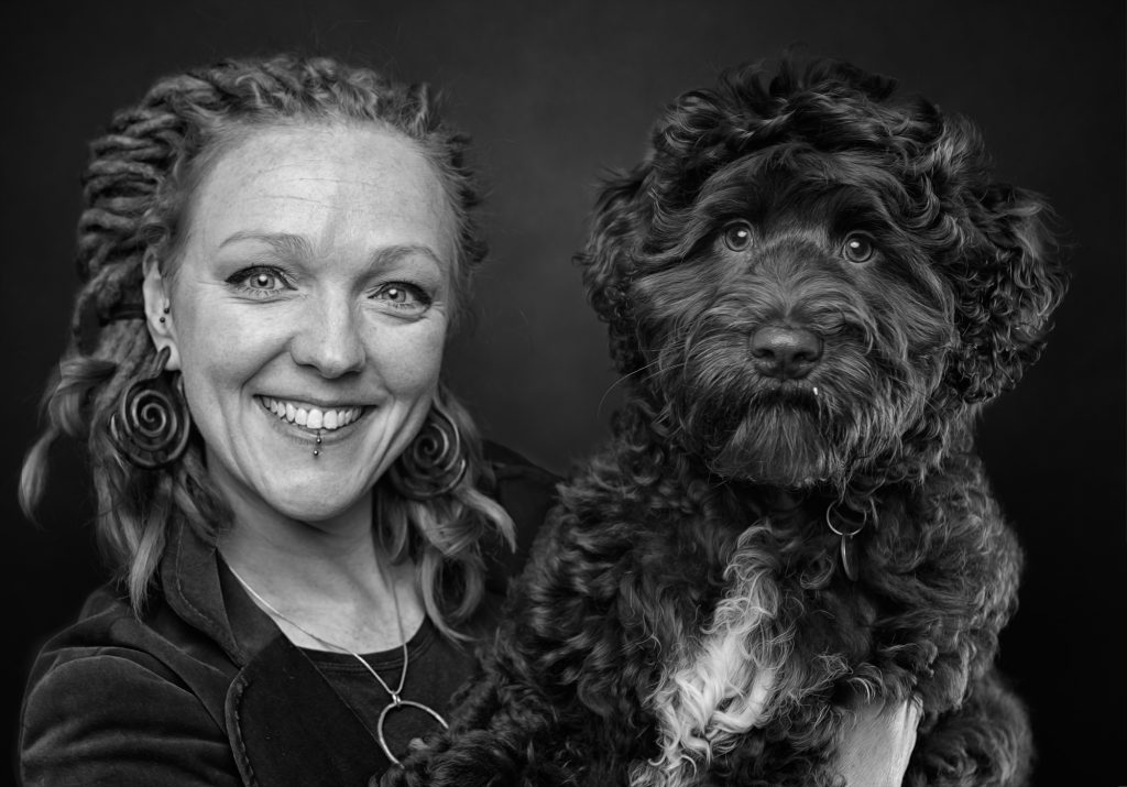 image of lady with her Barbet French Water Dog