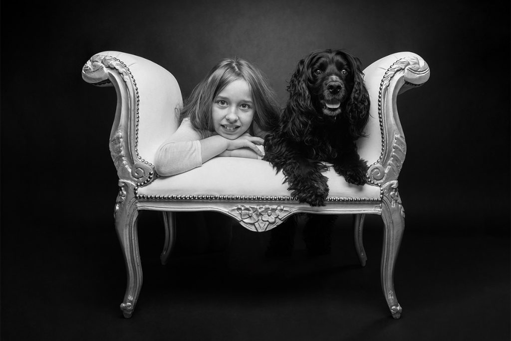 image of girl with her cocker spaniel dog